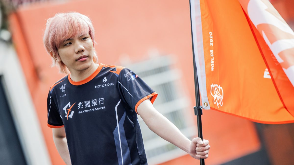 Beyond Gaming ADC Wako stares into the distance while holding a flag