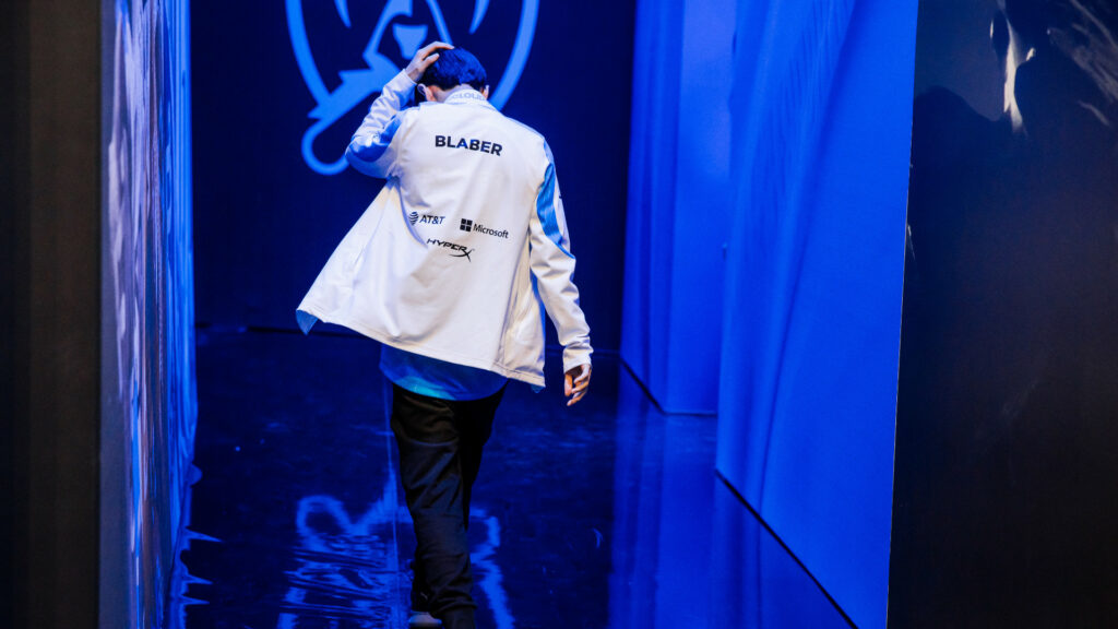Image shows C9 player Blaber walking away from the camera, rubbing his head. His body language indicates sadness and dejection.